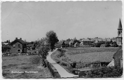 23-10033 Zicht op het dorp vanaf de dijk met rechts de hervormde kerk